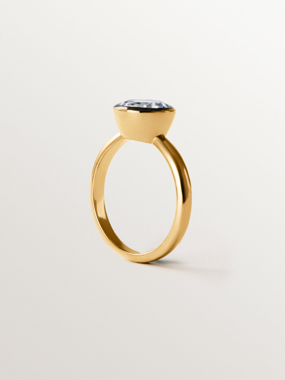 Two-tone 925 silver ring plated in 18K yellow gold with white topaz