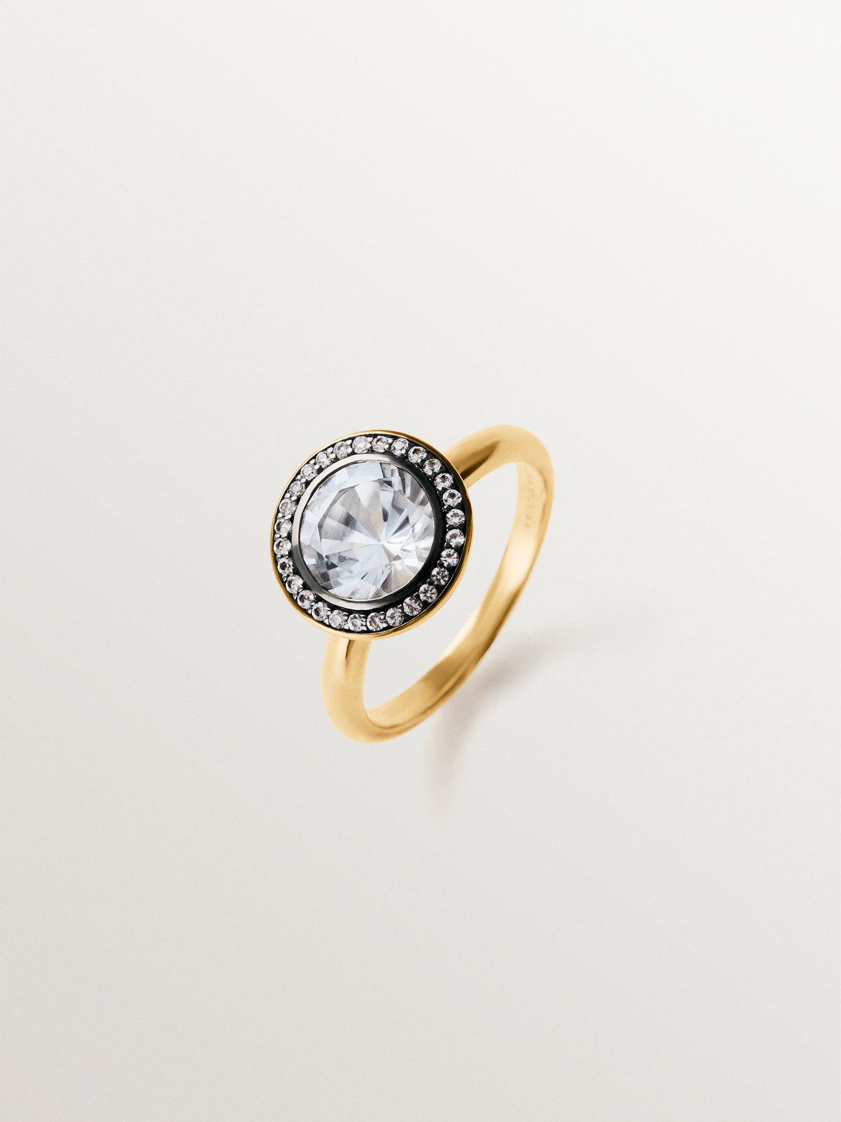 Two-tone 925 silver ring plated in 18K yellow gold with white topaz