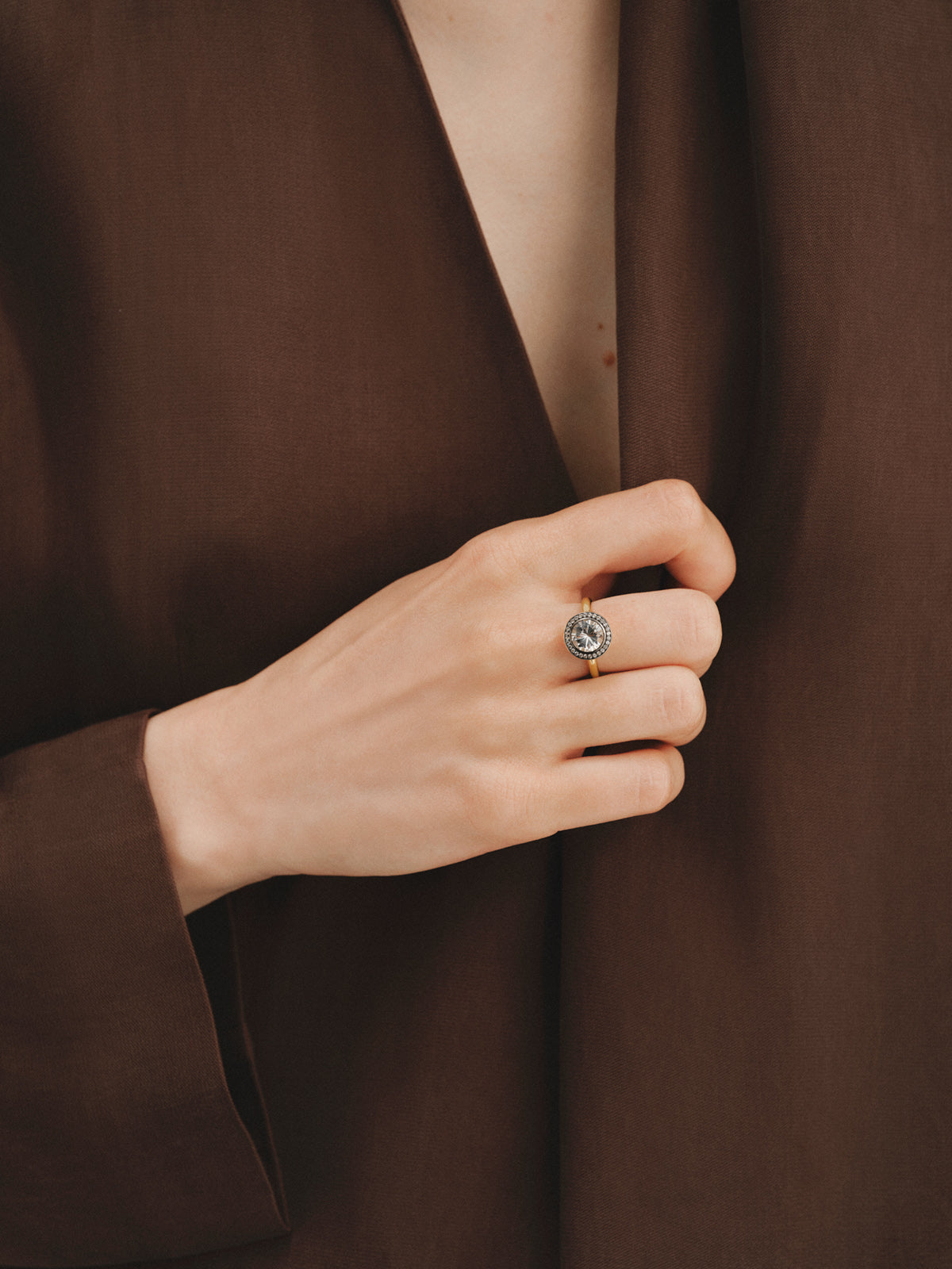 Two-tone 925 silver ring plated in 18K yellow gold with white topaz