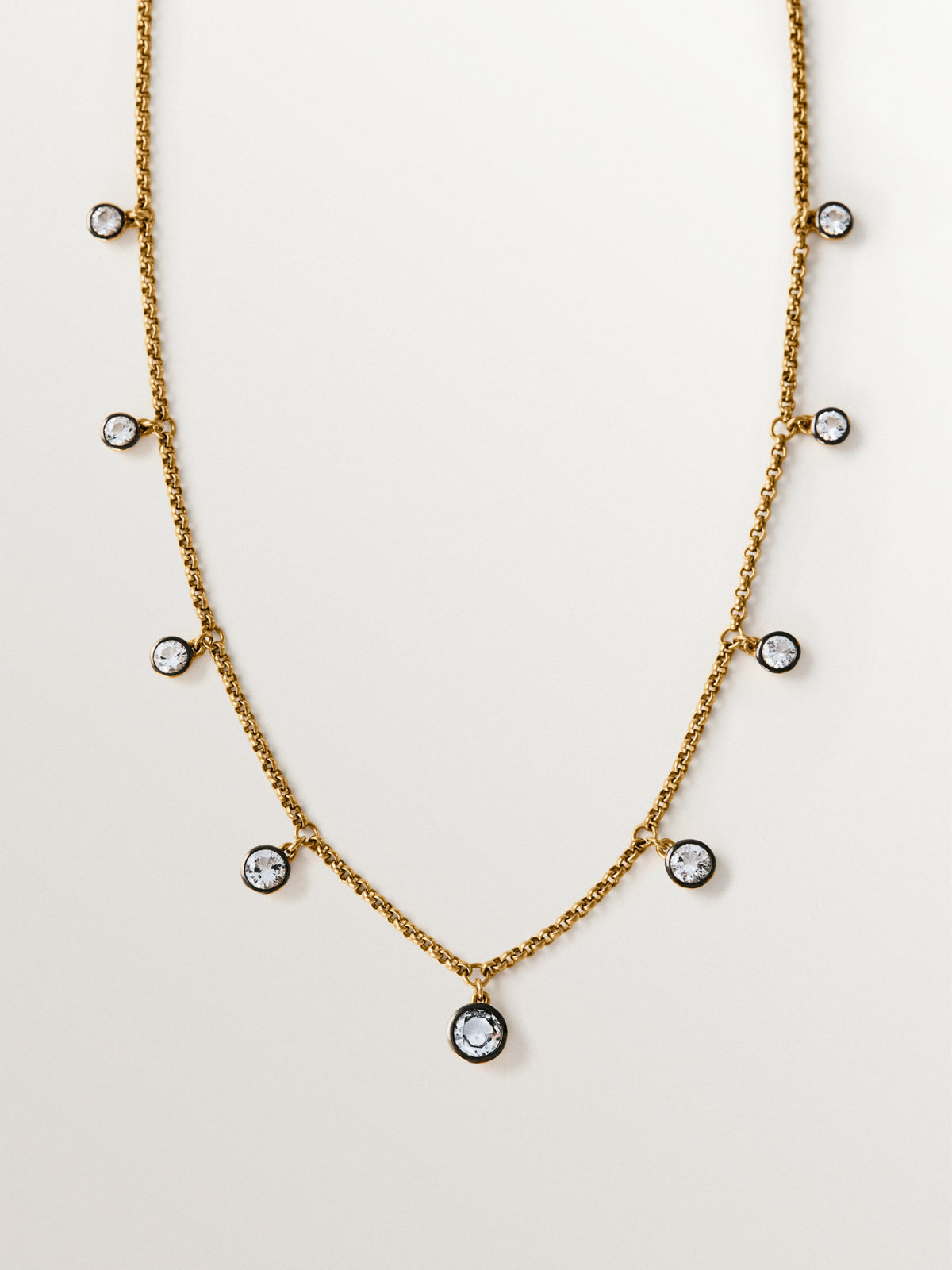 Two-tone necklace in 925 silver plated in 18K yellow gold with white topaz