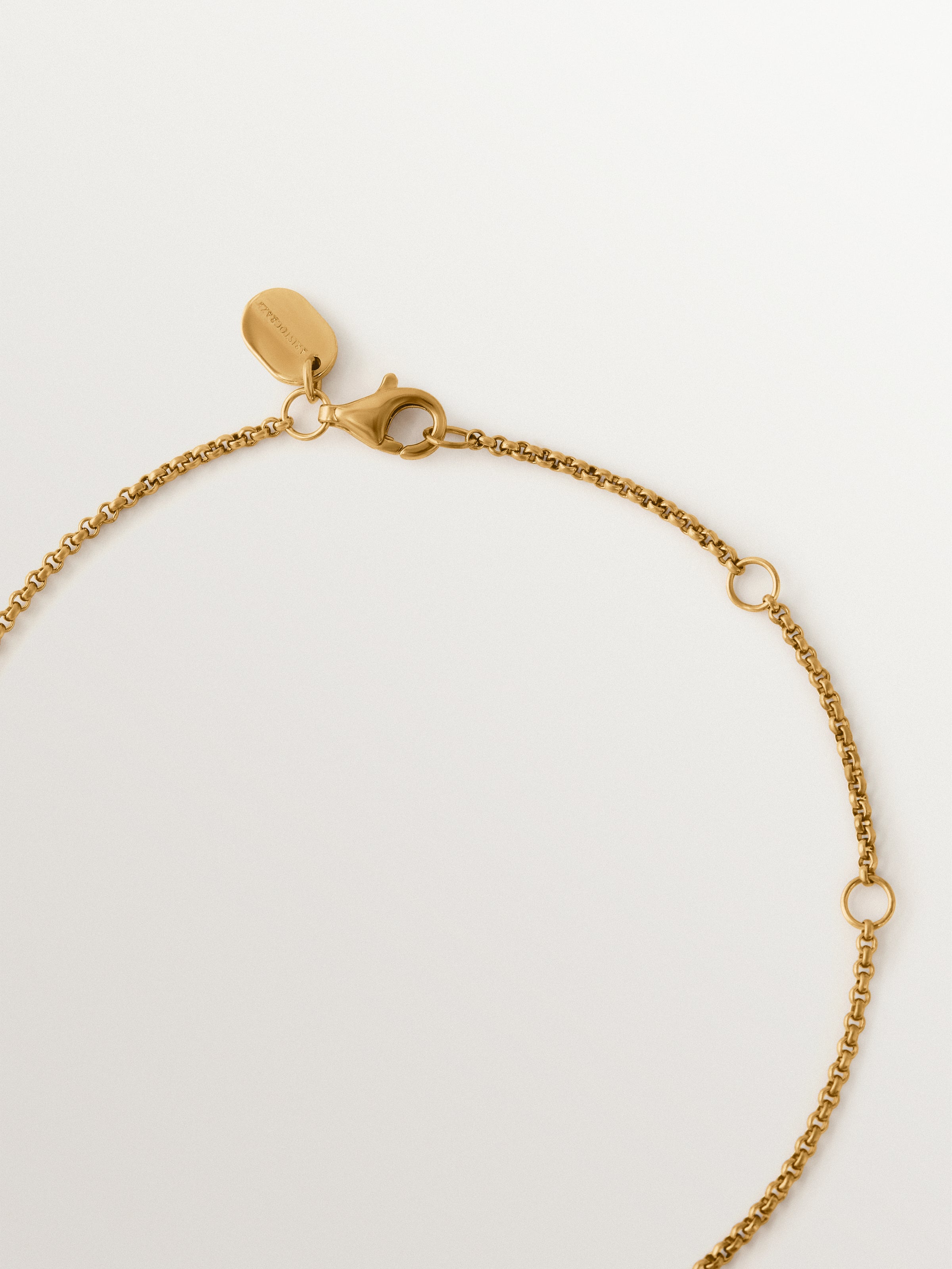 Two-tone necklace in 925 silver plated in 18K yellow gold with white topaz