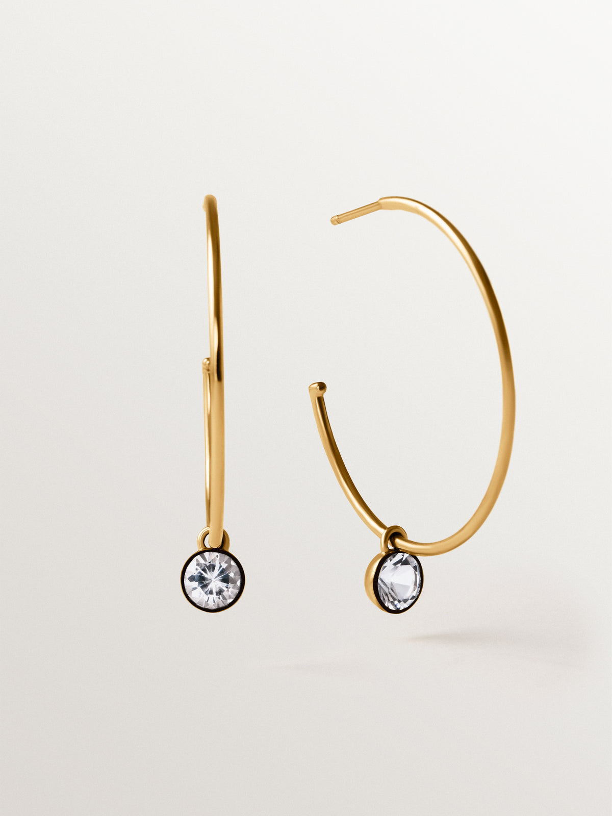 Large two-tone hoop earrings in 925 silver plated in 18K yellow gold with white topaz