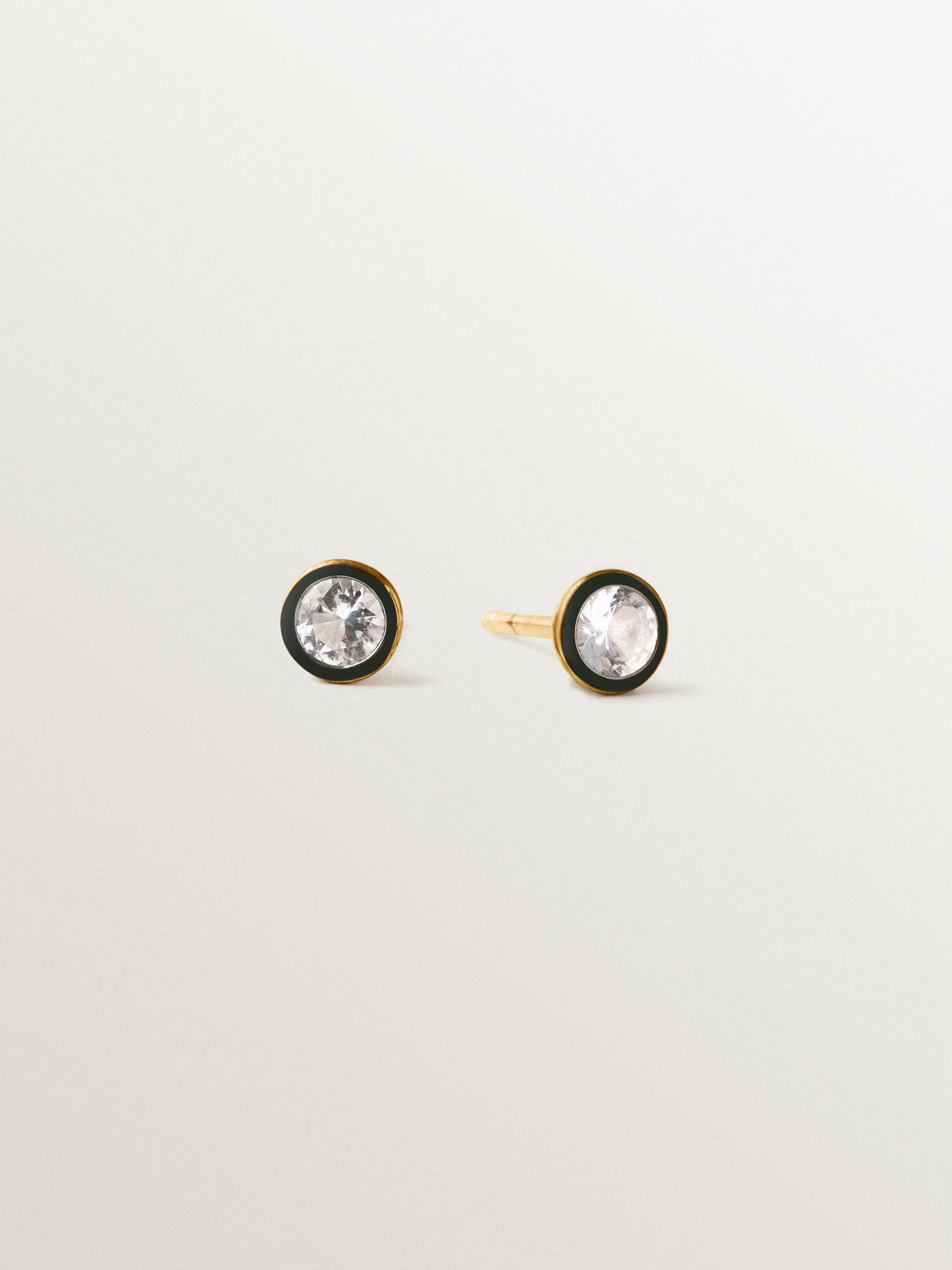 Two-tone earrings in 925 silver plated in 18K yellow gold with white topaz