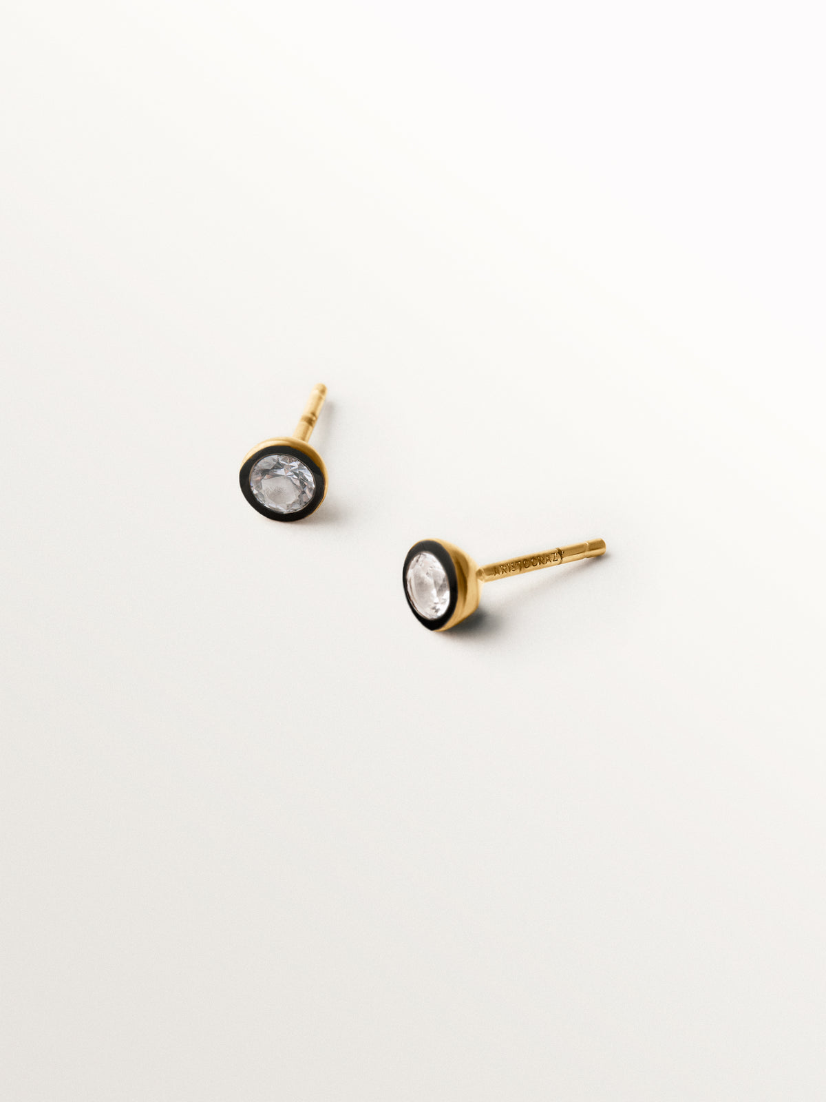 Two-tone earrings in 925 silver plated in 18K yellow gold with white topaz