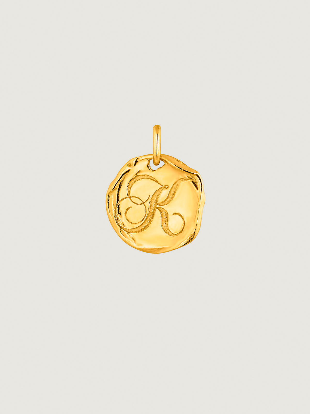Handcrafted 925 silver charm, bathed in 18K yellow gold with initial K.