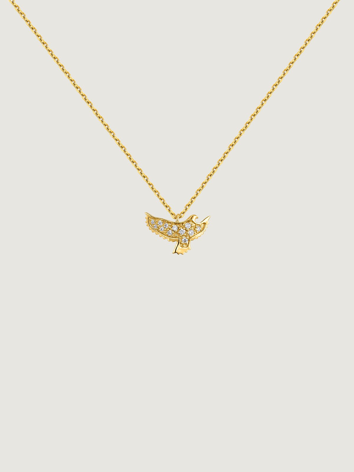 18K yellow gold pendant in the shape of an eagle with diamonds